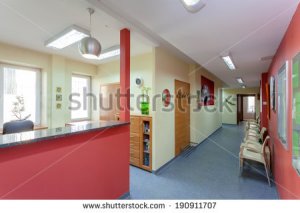 stock-photo-waiting-room-with-reception-in-medical-clinic-190911707